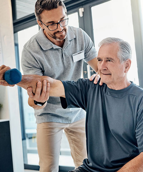 An Old Patient Getting Active Rehab Therapy From His Therapist