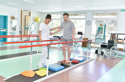 Patient Doing Exercise With Equipment For Rehabilitation