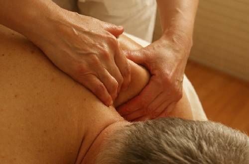 Therapist Giving Massage Therapy To His Patient